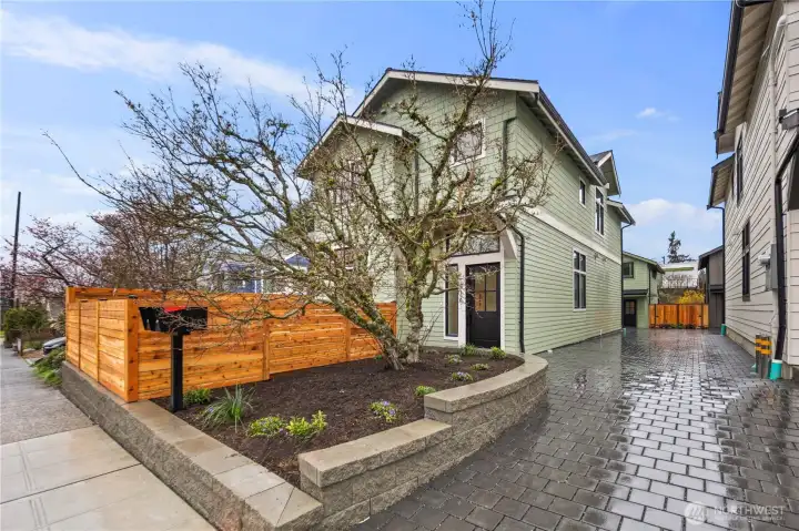 Private driveway leads to garage loaded from back of home.  When this cherry tree blooms, its spectacular!