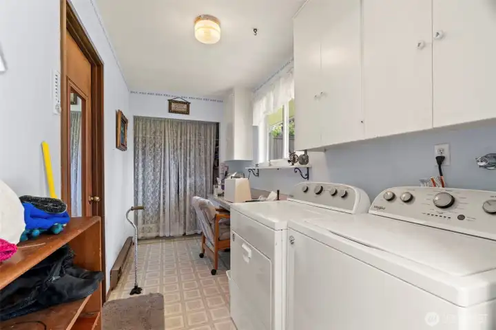 Laundry room with door to garage