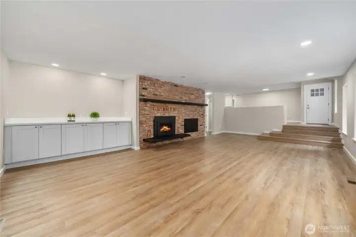 Looking back toward the entry. Recessed lighting thru-out the home supports the natural lighting from lots of large windows.