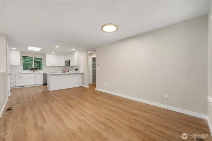 Upon entry, the dining area and kitchen are on your right. Large enough for an entertainment-sized table!