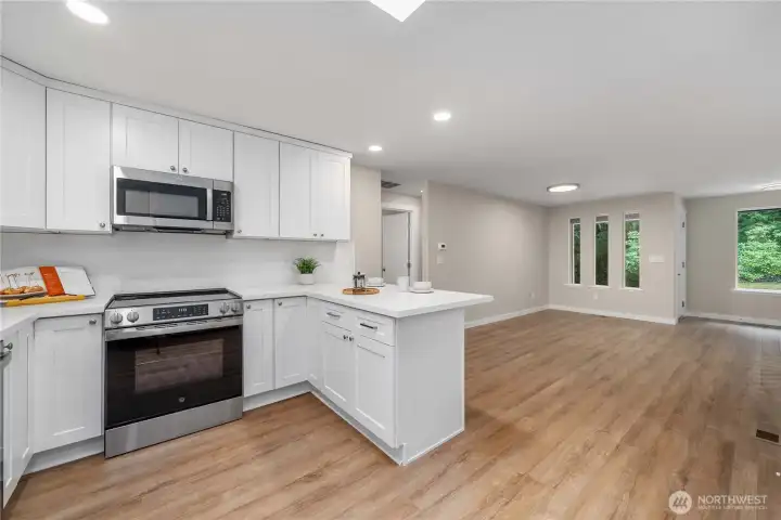 Notice the Quartz extends onto the walls in the kitchen. This adds a luxury touch, while also being practical for cleaning.