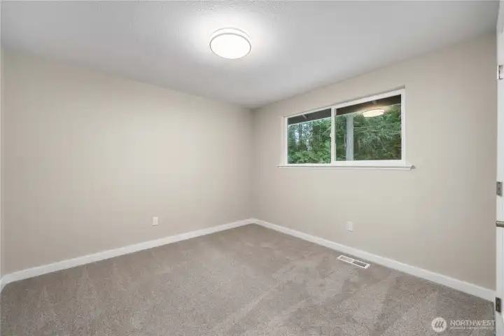 Bedroom #3 is located off the kitchen.