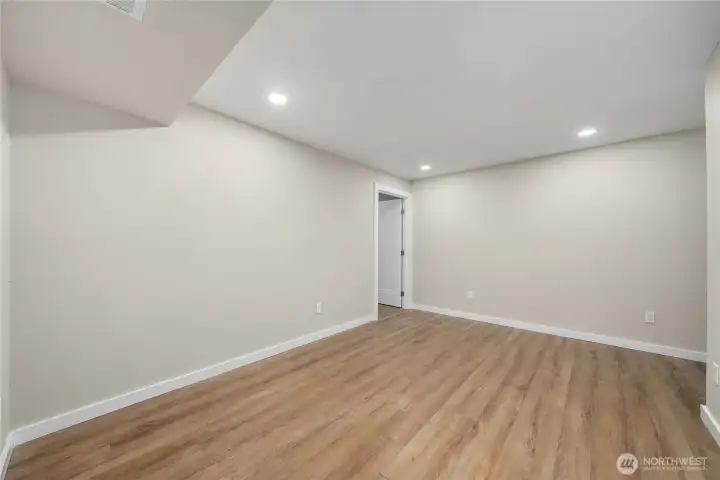 Lower level - extra finished room. This would make a great hobby room, home office, or storage room.