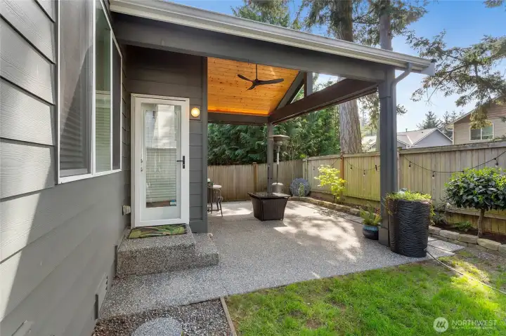 Inviting covered patio designed for comfort and entertaining, complete with generous seating space and protection from the elements. Ideal for relaxing evenings or hosting guests outdoors.  A seamless extension of the home that’s perfect for entertaining in any season.