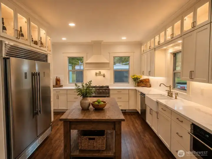Your kitchen is huge and features hand made custom built cabinets.- virtually staged