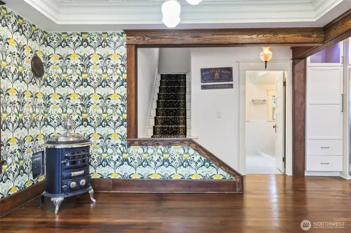 This potbelly stove can have a hearth installed and it can be installed at buyer's request.- Stairs to left, door to bath on Right and kitchen beyond that.