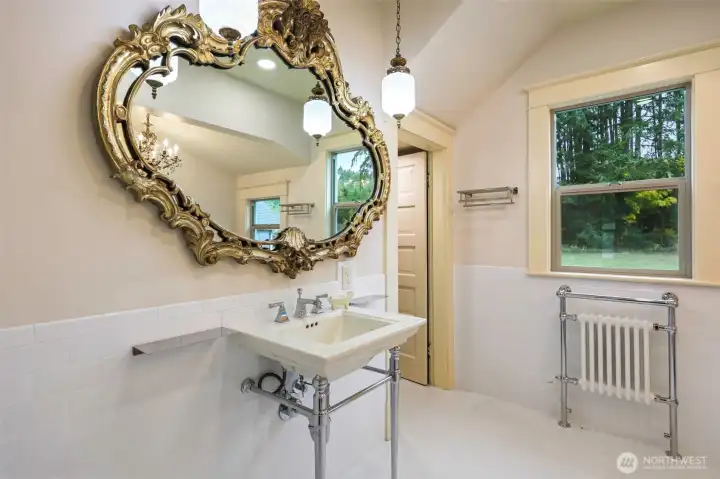Console sink- This bathroom features also separate toilet area and bathroom is accessible from main floor bath and main living areas.
