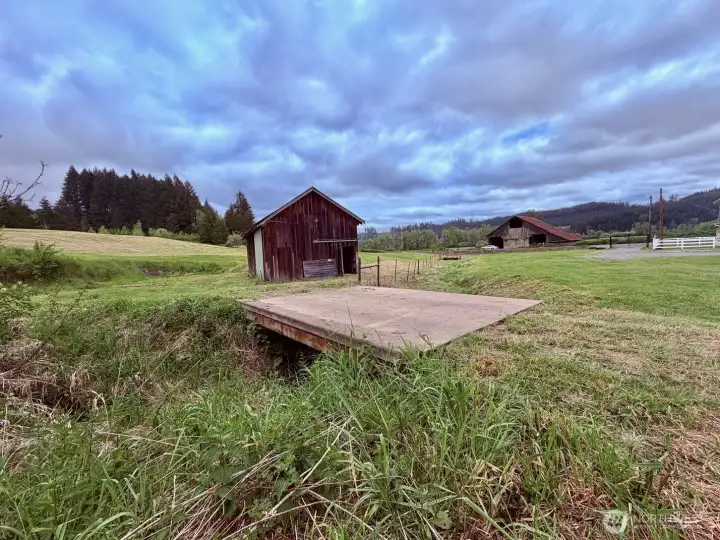 The bridge over the creek is strong enough for your vehicles and tractors to drive over.
