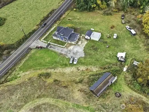1604 Lincoln Creek from above- home and out buildings- note well house/storage and shop/garage have now been painted.