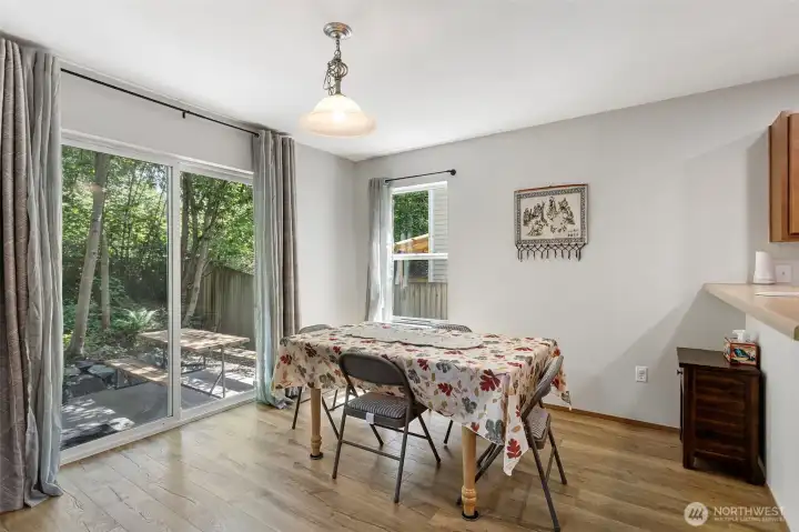 Spacious dining area with view of the private patio.