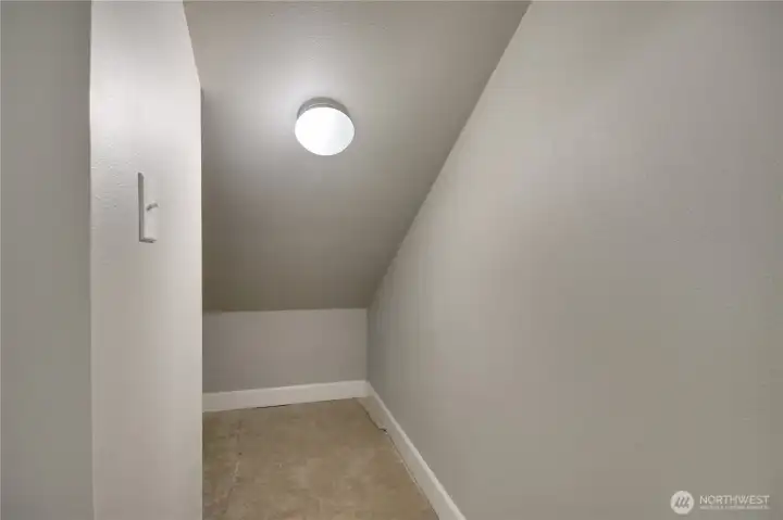 Extra storage in laundry room which wraps around the wall for more storage