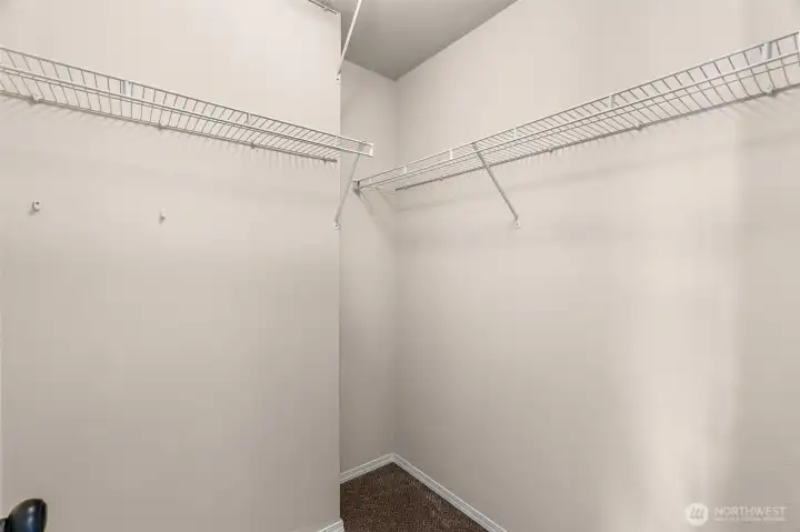 Walk-in closet in Primary Bedroom Walk-in closet in Primary Bedroom