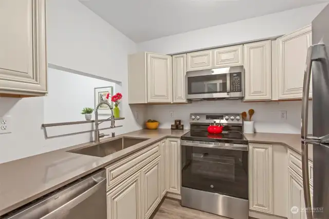 This home has been remodeled with all new appliances, paint, flooring, and more! Kitchen backsplash and a few details are not quite done.
