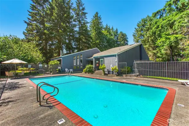 This condo has great amenities including this awesome heated swimming pool and the recreational building behind it!
