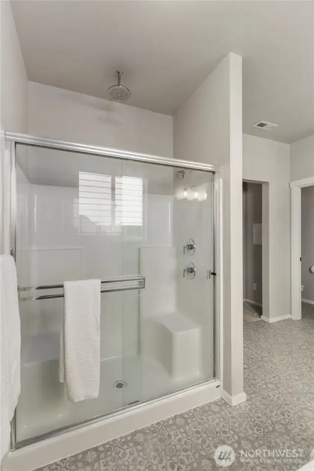 Separate shower with dual shower heads.