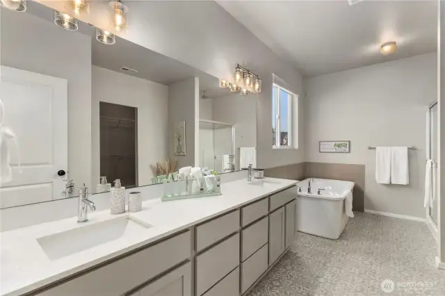 Spa-inspired 5-piece bath with soaking tub, walk-in shower, and elegant finishes for complete relaxation.