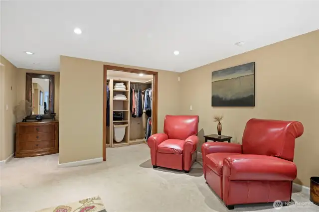 Sitting area and walk-in closet round out the room.