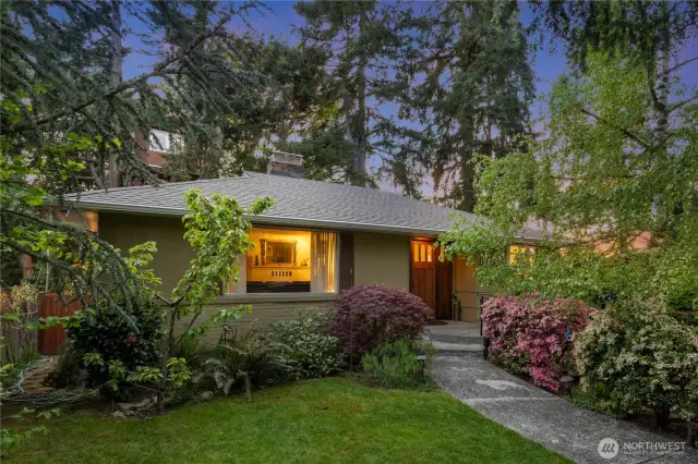 Lush front yard welcomes you to the home.
