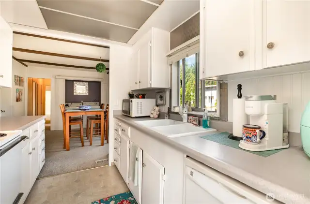 Another view of the kitchen peering into the dining area.