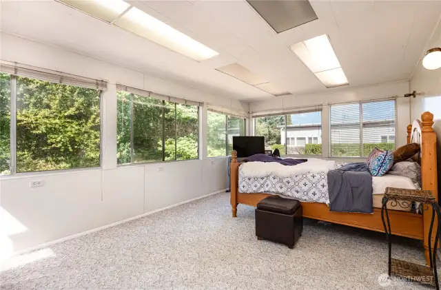 Primary bedroom features wall to wall windows!