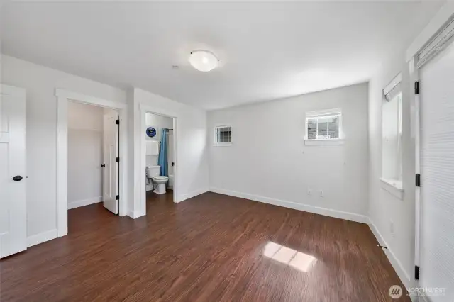 Lower level junior suite with ensuite bath and walk-in closet.