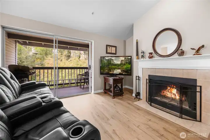 Living room w/ wood burning fireplace