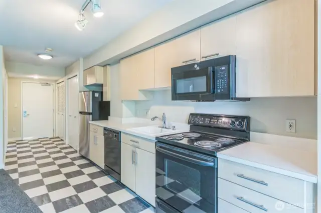 Beautiful Italian tile flooring extends through the kitchen, entry, and bath—adding timeless style and durability.