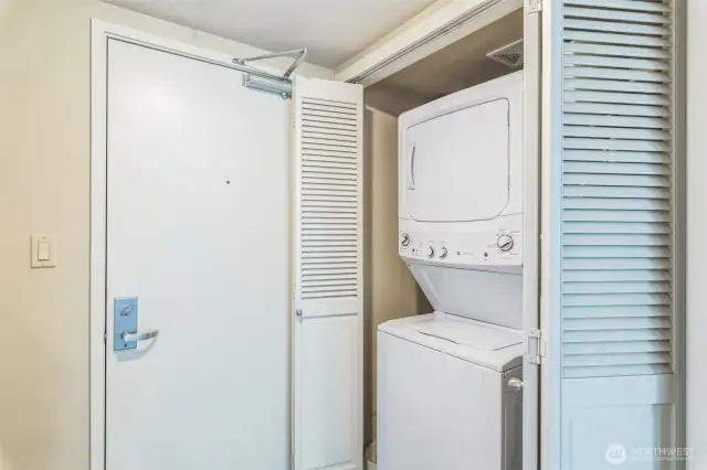 Conveniently situated near the elevator and refuse closet, this unit also includes a secure parking space and a dedicated storage room in the common garage, located just steps from the entry for added ease and accessibility.