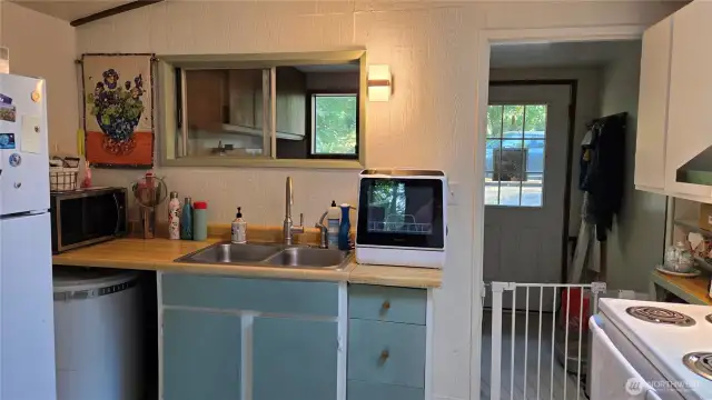 Utility room leads into kitchen
