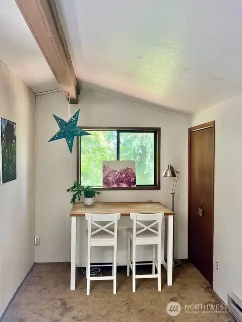 small dining room with adjacent pantry/storage area