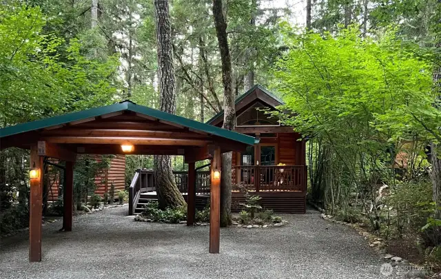 20 SPRUCE - CABIN WITH CARPORT AND 2 SHEDS.   4320 SQ FT LOT