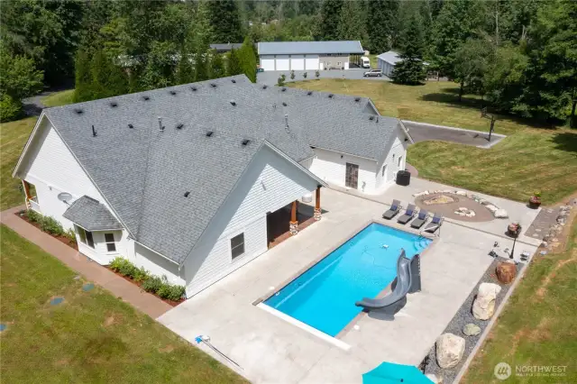 Enjoy the private backyard, in-ground pool and propane fire pit- just in time for summer!