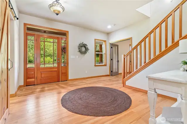 Welcoming and bright front entry. There are hardwood floors on the main level of the home