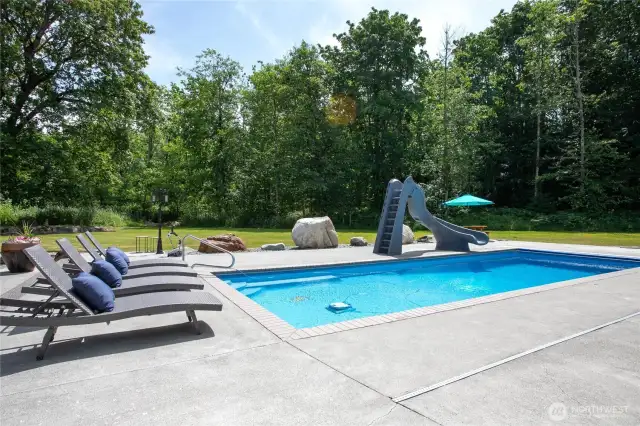 16x40 fiberglass pool is 9ft. deep with slide and heat pump pool heater