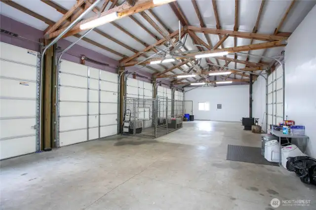 The second shop is 25x60 with 5 doors. there is a dog run on the back  (West) side of this shop and one drive-through door