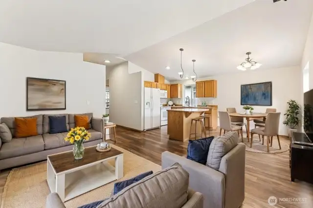 The vaulted ceilings, open floor plan and lots of natural light make the space feel larger than it is. This photo is virtually staged.