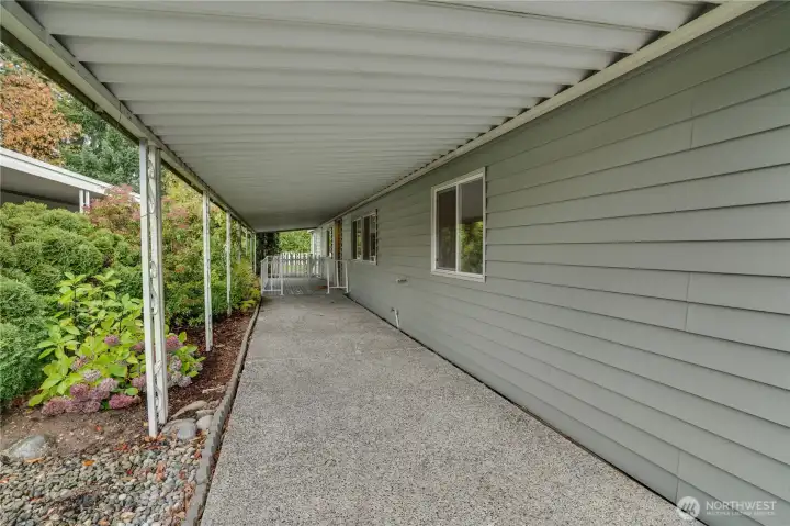 The spacious covered porch offers room for outdoor furniture—enjoy fresh air even on rainy days.