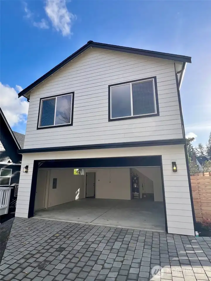 Detached 2 car garage with studio apartment above.