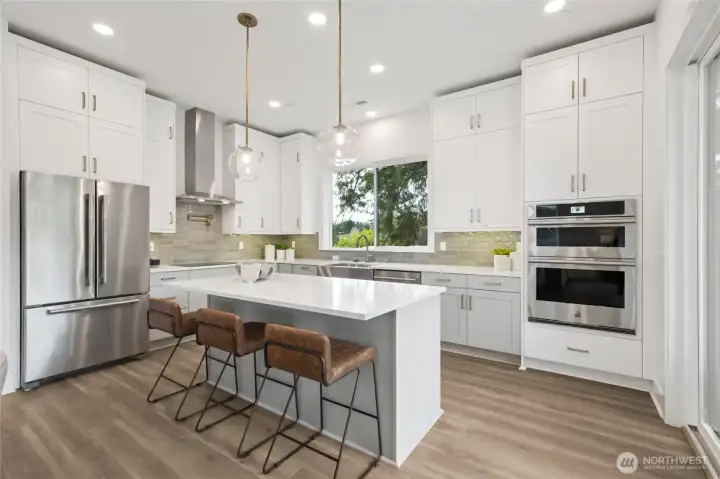 Kitchen with 10' ceilings, double stacked cabinets, induction cooking, pot filler and JennAire appliances (included) (Facade, Ext Colors, Interior Photos & Floor Plans for illustrative purposes only. Actual Facade, Ext Colors, Interiors & Floor Plans may differ.)