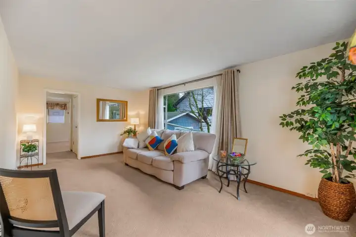 Front living with big picture window facing south fills the space with light.