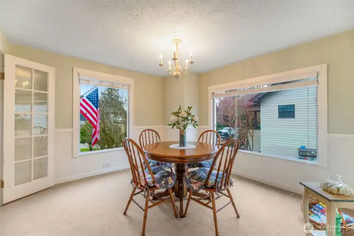 Large windows flank the dining room and provide abundant light.