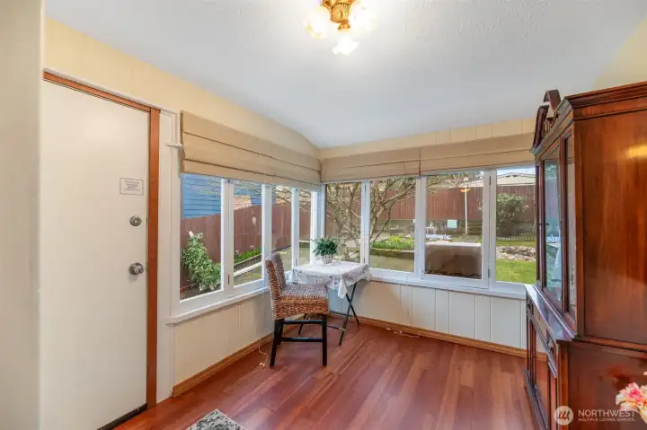 Back sunroom leads to the private fully fenced back yard.