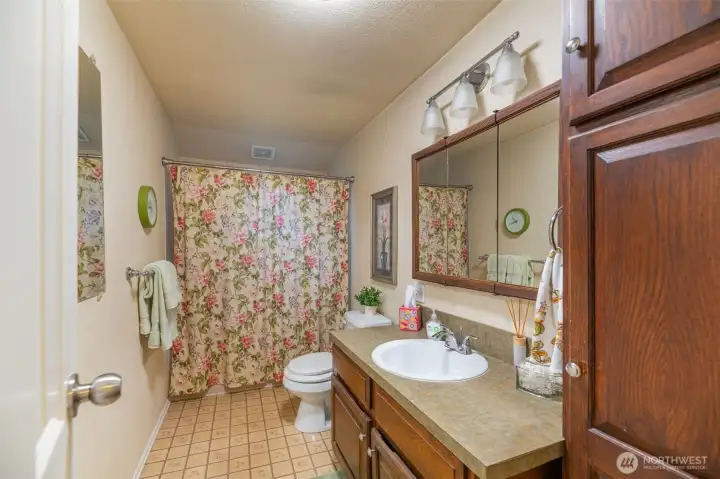 Main floor bath is functional and efficient.