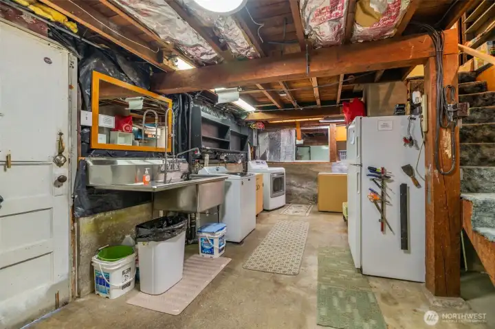 Bring your ideas for this unfinished basement. Easily gain sweat equity by finishing the space. Bathroom, Family room, Bedroom?  Whatever can be imagined with 7+ foot ceilings. Door to the left leads to driveway/