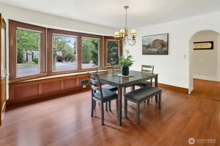 A graceful curved archway adds architectural charm and timeless character, seamlessly connecting the living spaces.