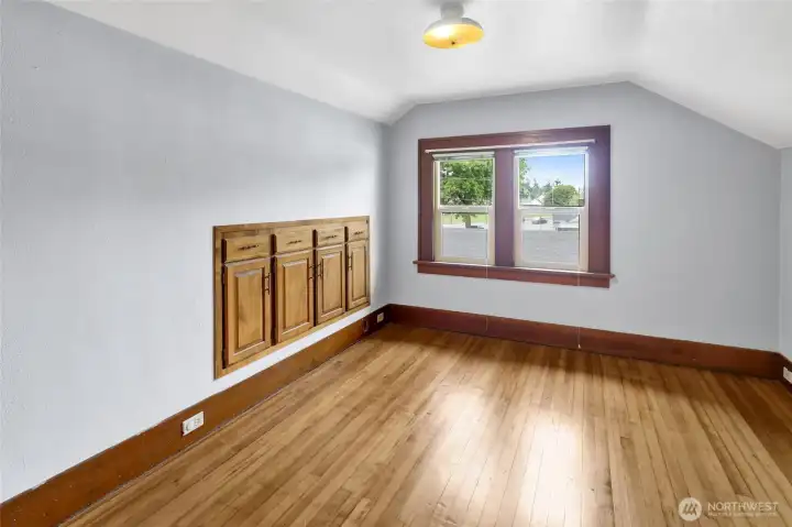 Bedroom #1 features more built-ins plus a walk-in-closet.