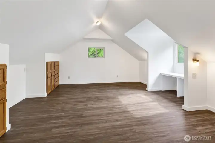 Bedroom #3 is spacious and features brand-new LVP flooring. If another bedroom isn't needed, it easily converts to a playroom, exercise space, storage area, or even a primary bedroom.