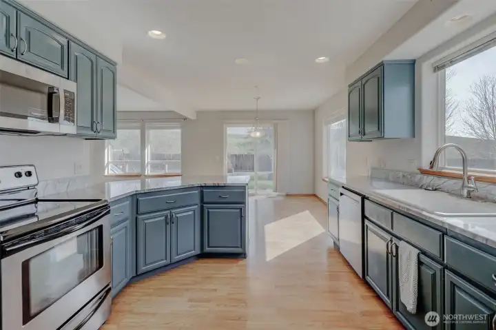 Wood-wrapped windows add warmth, character, and timeless craftsmanship throughout the home