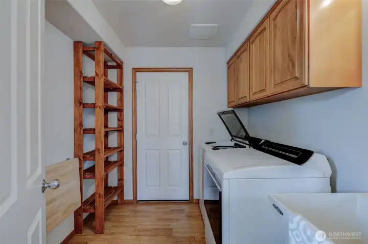 Convenient laundry room located just off the garage and kitchen for everyday functionality.