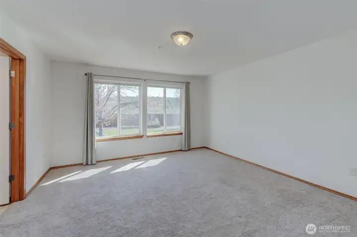 Primary suite offers dual closets plus walk-in closet for exceptional storage and organization.